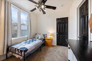 Bedroom with carpet and ceiling fan