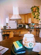 Dining space with a textured ceiling