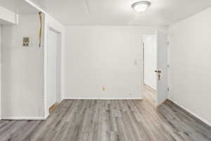 Spare room with light wood finished floors