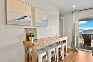 Dining space featuring light wood-type flooring and recessed lighting