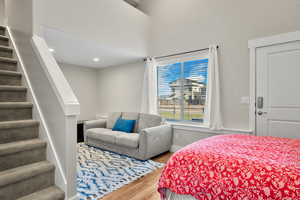 Bedroom featuring wood finished floors and baseboards