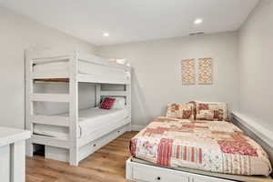 Bedroom featuring light wood-type flooring and recessed lighting