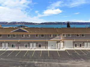 Exterior space with a water and mountain view