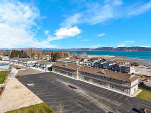Aerial perspective of suburban area with a water and mountain view