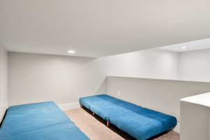 Carpeted bedroom with recessed lighting and baseboards
