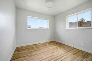 Spare room featuring light wood finished floors