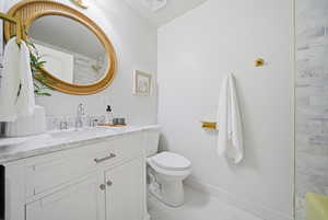 Full bathroom with vanity and light marble finish floors