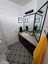 Bathroom with vanity and toilet