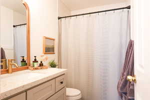 Bathroom with vanity and a shower with curtain