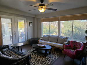 BONUS ROOM with french doors and a ceiling fan