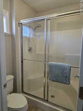 Third bathroom in casita with a shower stall and toilet