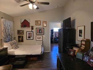 Primary Bedroom with vaulted ceiling, dark wood-style floors, and a ceiling fan