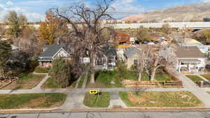 Aerial view of residential area featuring a mountainous background