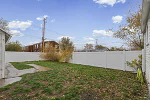 View of fenced backyard