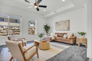 Living room featuring carpet, recessed lighting, and ceiling fan