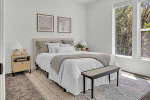 Carpeted bedroom with baseboards