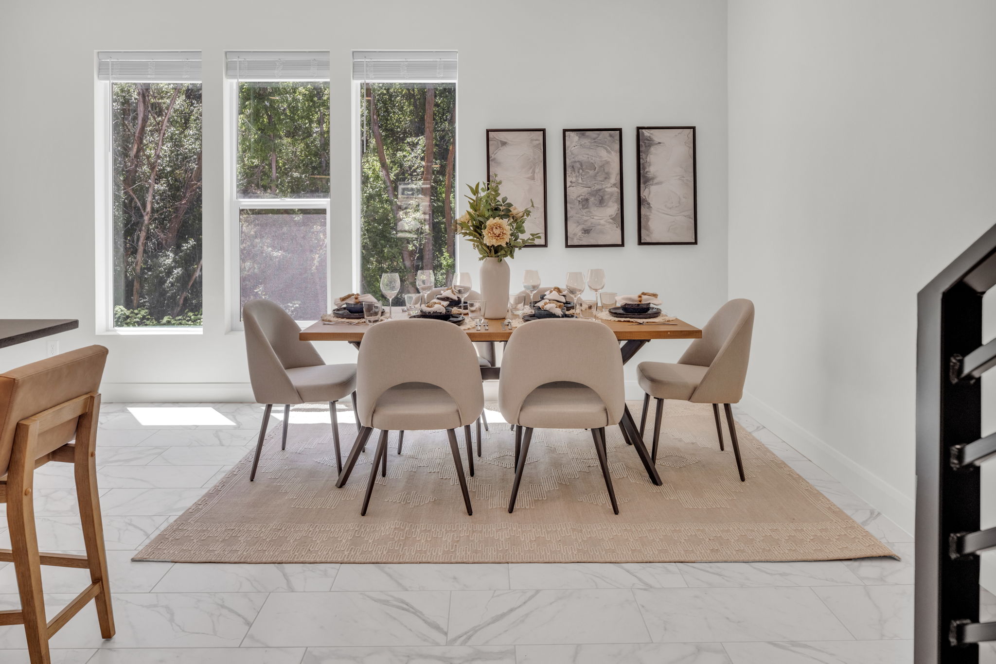 Dining space featuring light marble finish flooring and baseboards