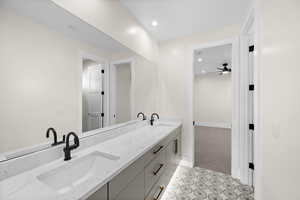 This Jack and Jill bathroom is truly a must-see, featuring two separate sinks, ample drawers, and an expansive, beautifully designed shower.