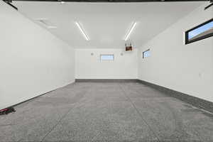 This garage bay features 2 deep car garage spaces, complete with epoxy floors, large bays, and heating to ensure ease and comfort year-round.