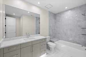 Generously sized basement bathroom designed with convenience in mind.