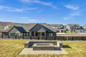 Experience cozy evenings by the fire with panoramic views of Lone Peak Canyon—a standout feature of this home.