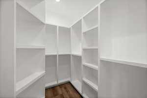 A large walk-in closet completes this exquisite bedroom, providing ample storage while maintaining an elegant, uncluttered feel.