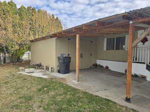 View of patio featuring an attached carport