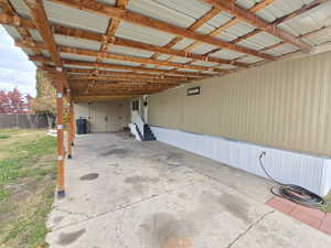 Garage featuring a carport