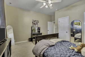 Bedroom featuring light colored carpet and ceiling fan