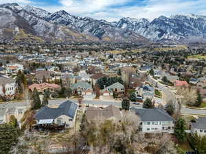 Aerial perspective of suburban area featuring a mountain backdrop