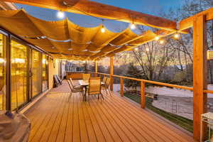 Wooden terrace featuring outdoor dining area
