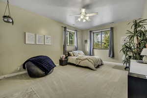Bedroom featuring carpet flooring and ceiling fan