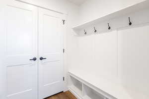 Mudroom with dark wood-style floors