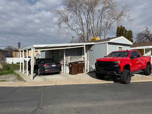 View of front facade with an attached carport