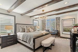 Bedroom featuring light colored carpet, a chandelier, beam ceiling, and recessed lighting