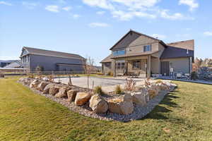 Rear view of property featuring a patio and stucco siding