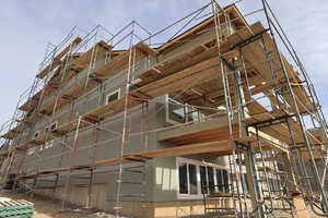 Back of the home with daylight basement