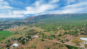 Aerial view of sparsely populated area featuring a mountainous background