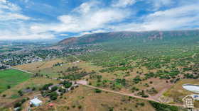 Aerial view of sparsely populated area featuring a mountainous background