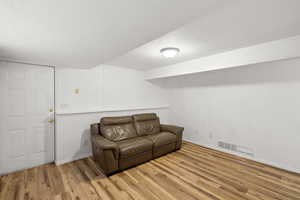 Sitting room featuring a textured ceiling and light wood-style floors