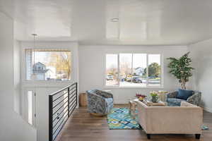 Living area of great room with lots of natural light and mountain views