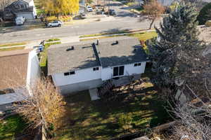 Aerial perspective of back of home and backyard looking east