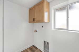 Hook-ups for laundry with a cabinet above