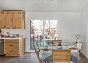 Semi-formal dining area with a view out the sliders to the west