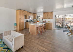 Great room kitchen area with separate island and sliders out to the back deck
