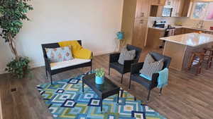 Living area and LVP flooring to kitchen