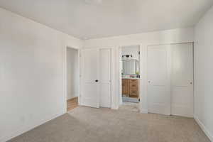 Primary bedroom closets with separate access to main bath