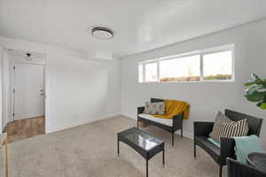 Family room down with lots of above-ground windows