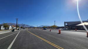 View of asphalt street with a mountain view