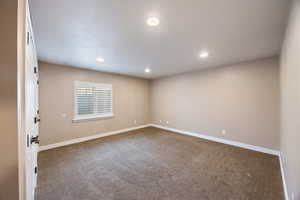 Unfurnished room featuring carpet floors and recessed lighting